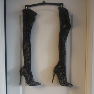 Dramatic Black and Gold Over-the-Knee Stiletto Boots